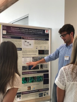 Jaret presenting his poster at the REU Symposium